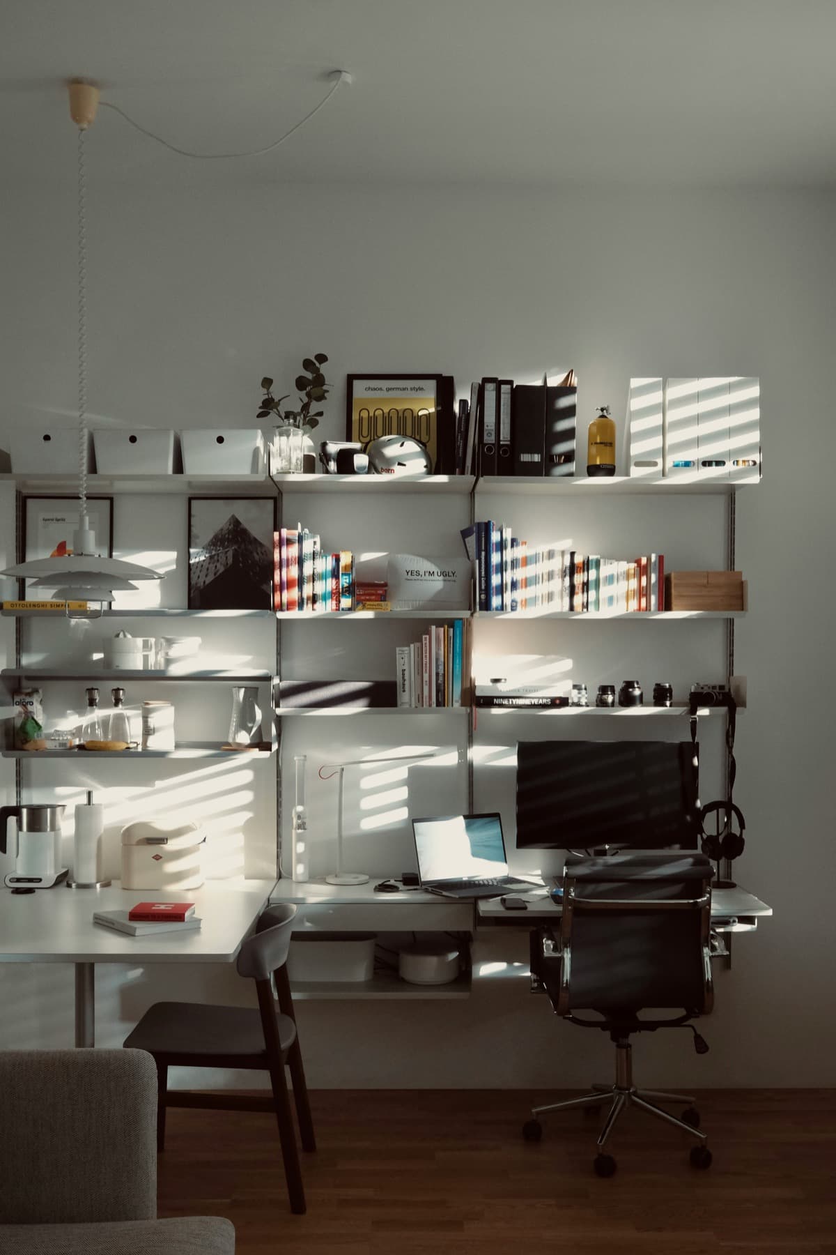 Architecture studio workspace with sketches, desks, and pinned-up work