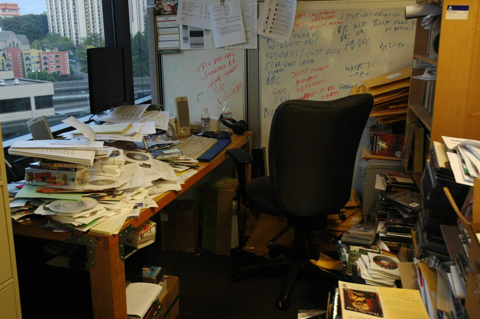 Business proposal documents and pricing papers laid out for review on a meeting table